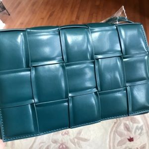 Padded cassette bag clutch